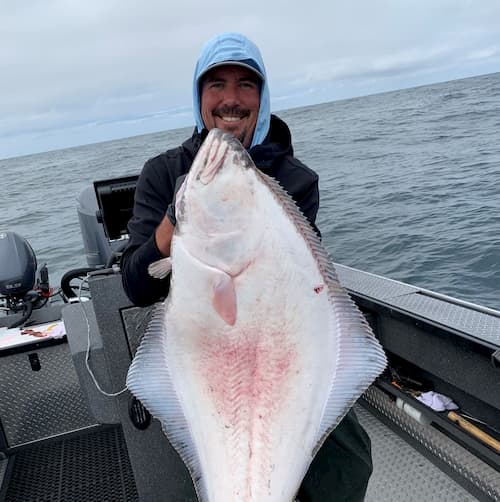 Determined and focused handsome senior male independent commercial  fisherman operates fishing equipment while long line fishing for halibut in  the North Pacific Ocean off the Oregon Coast Stock Photo - Alamy