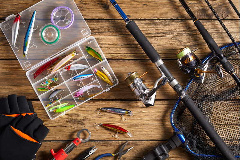 Brightly colored fish bait and a few fishing poles